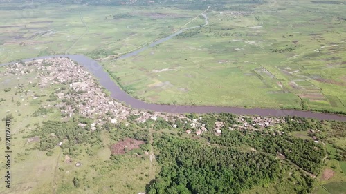 Wjde shot of Village and Farmland in background along Oueme river photo