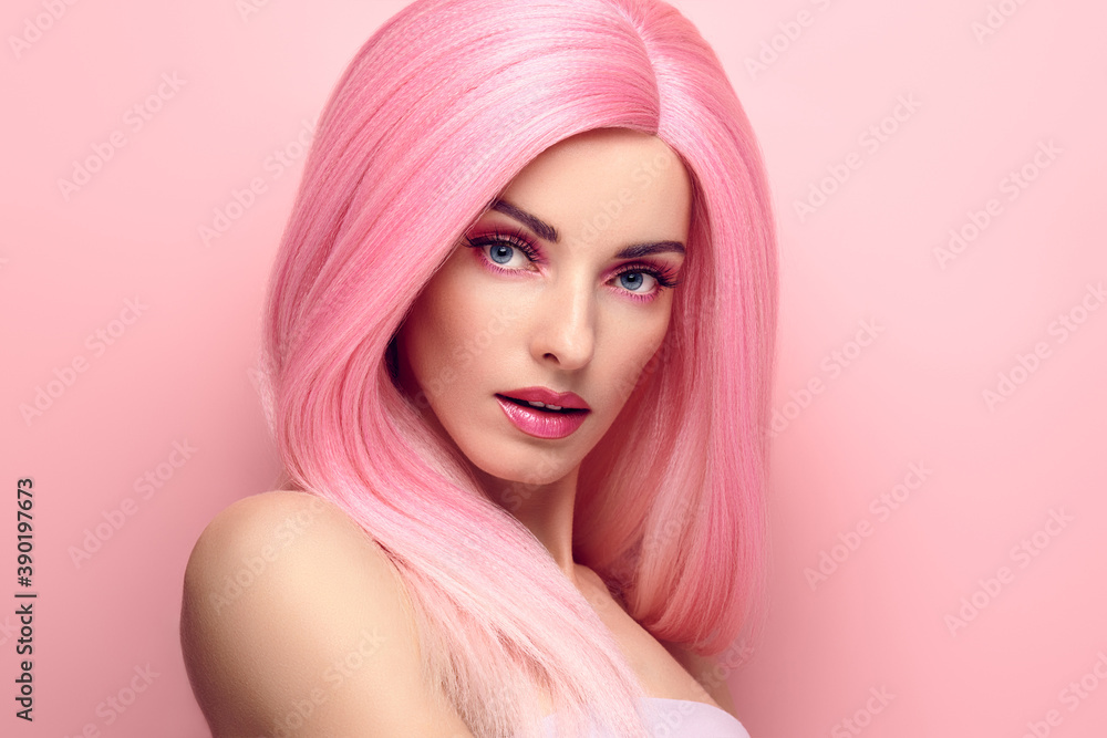 Beauty Fashion woman with Colorful Pink Dyed Hair. Girl with blue eyes, perfect Makeup and Hairstyle. Beautiful smiling model portrait, fashionable pink make up, hair. Skincare concept