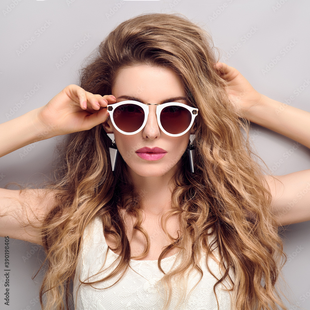 Beauty fashion woman portrait. Gorgeous young blonde with trendy wavy hair, makeup. Beautiful model girl, stylish sunglasses, fashionable hairstyle. Skincare make up concept Beauty fashion woman portrait. Gorgeous young blonde with trendy wavy hair, makeup. Beautiful model girl, stylish sunglasses, fashionable hairstyle. Skincare make up concept