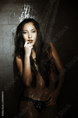 Young woman in the shower cabin