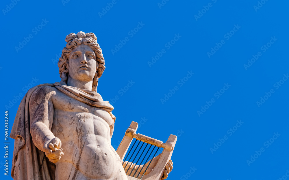 Fototapeta premium Athens Greece, Apollo ancient god of poetry and music marble statue on plain background, space for your text