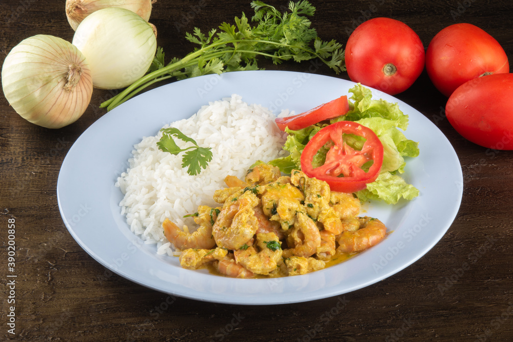 Brazilian gastronomy. Plate with shrimp muqueca. Delicious cuisine from northeastern Brazil.