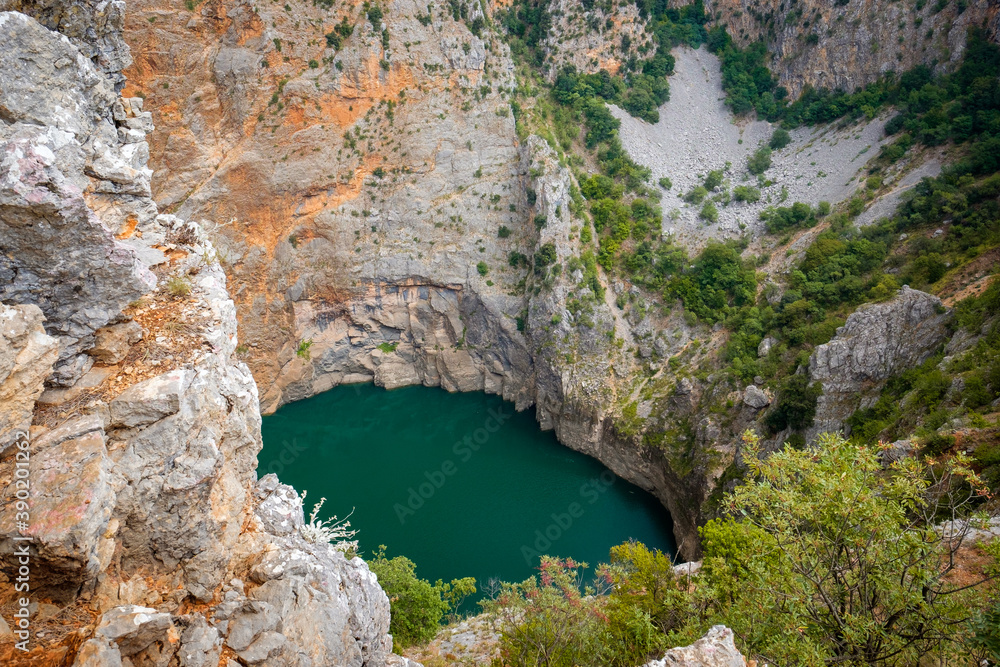 rock and blue lake in croatia