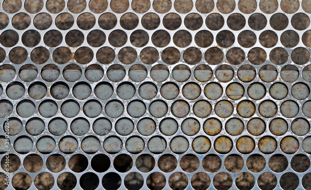 Perforated metallic surface texture background Perforated metallic surface texture background