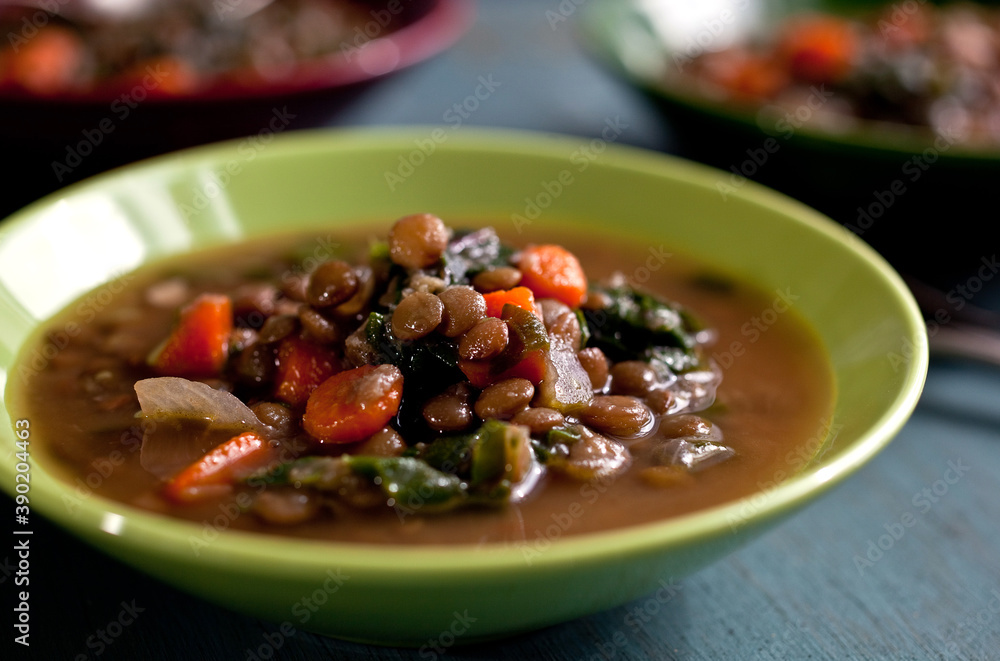 Close up of stew of French lentils with chard served in bowl Close up of stew of French lentils with chard served in bowl