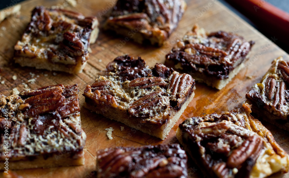 Close up of chocolate pecan bars on cutting board