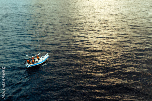 marine rescue boat sailing on the water on the sunset