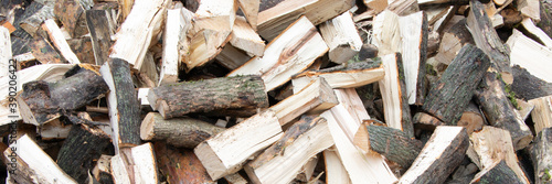Banner. Heap of chopped firewood background. Pile of split firewood. Stack of fuel wood