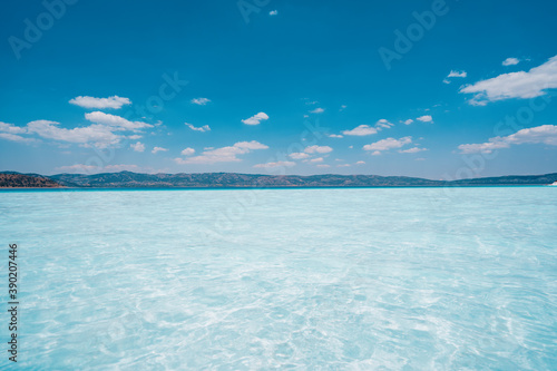 Summer sunny day  blue sky  white clouds and water sea background. Blue Sky Background.