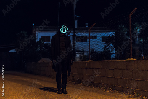 Scary masked man at night