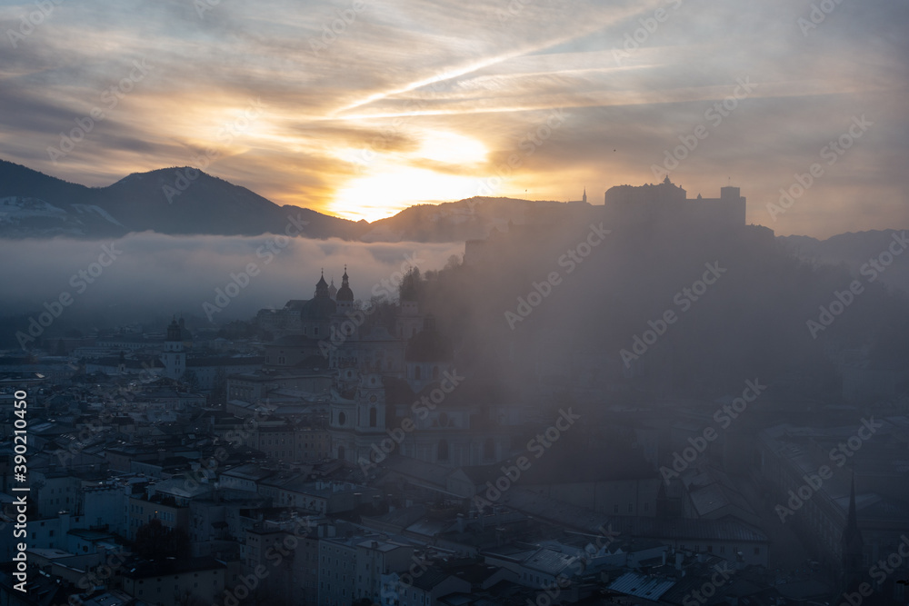 Fototapeta premium sunrise over the mountains in salzburg city - christmas morning sunrise