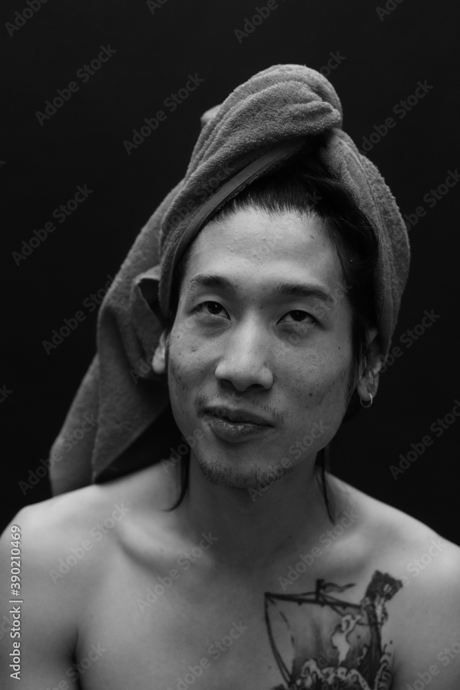 smiling man with shower towel on his head. smiling man with shower towel on his head.