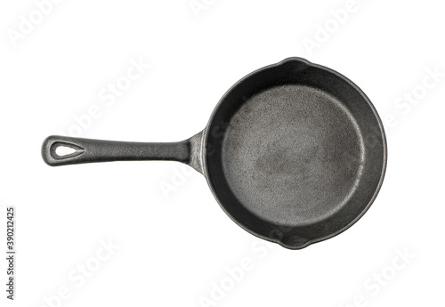 Cast iron frying pan top view isolated on a white background. Concept of kitchen utensils.