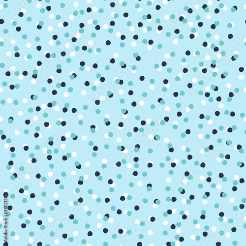 Seamless repeating spotted pattern with tiny colorful hand drawn confetti-like dots. Christmas, snowy winter, sky concept. Vector background for gift wrap, surface design and other design projects