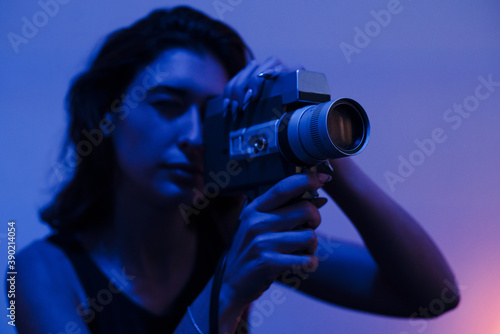 Woman filming with a Super 8mm camera