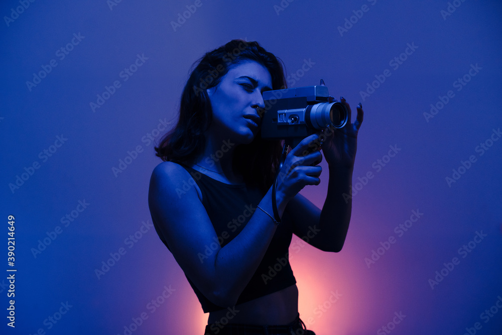 Woman filming with a Super 8mm camera Woman filming with a Super 8mm camera