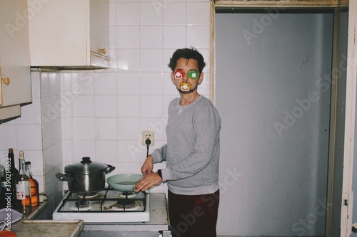 Strange person in kitchen