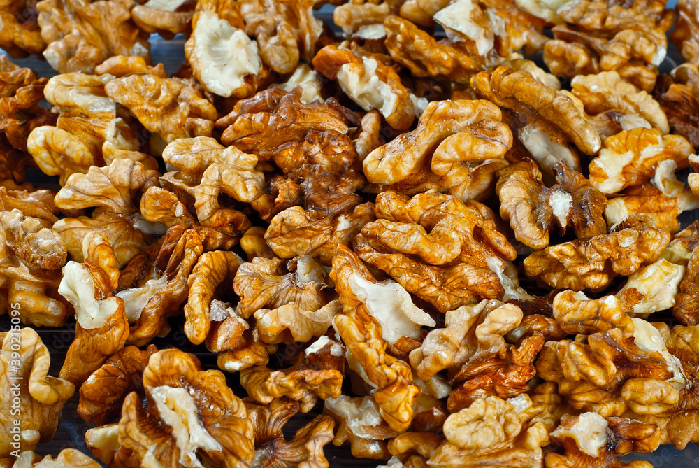 Walnut texture close up. Many halves of peeled nuts. Walnut texture close up. Many halves of peeled nuts.