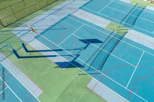 Aerial top down views of outdoor multi use sports hardcourt surfaces in eluding Basketball, Tennis and Netball photo