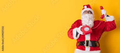 santa claus isolated on background talking on the phone