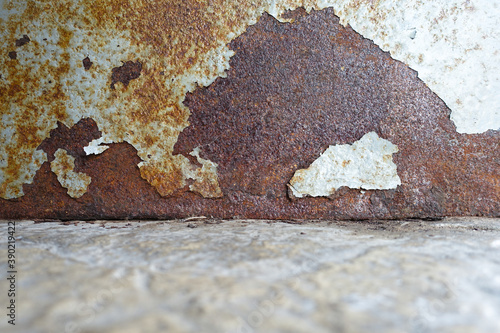 Old peeled rusty wall. Rust texture and background. Cracks, stains, spent wall.