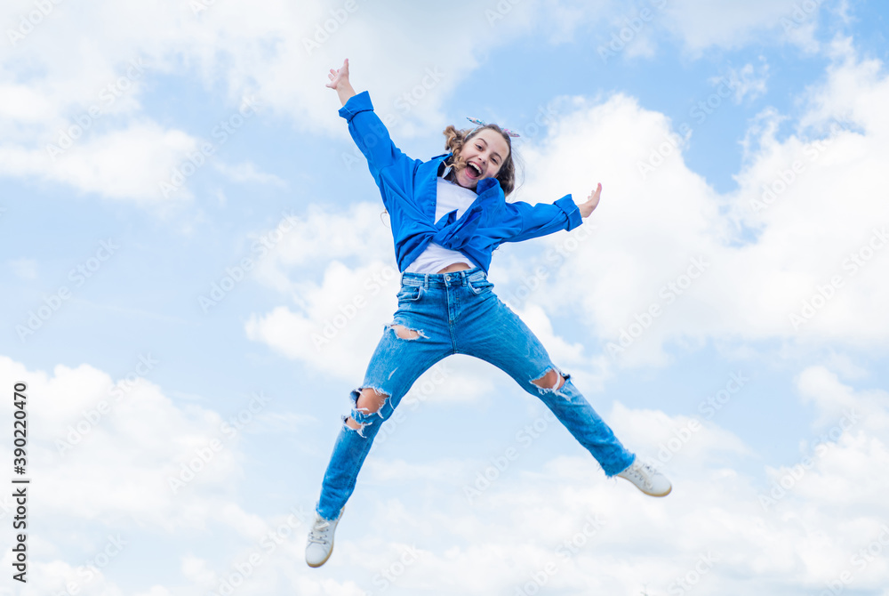 full of energy. childhood happiness. teen girl jumping high in the sky. having a party fun. Autumn style. Happy kid wear checkered shirt. Lifestyle and People Concept. kid spring and fall fashion full of energy. childhood happiness. teen girl jumping high in the sky. having a party fun. Autumn style. Happy kid wear checkered shirt. Lifestyle and People Concept. kid spring and fall fashion
