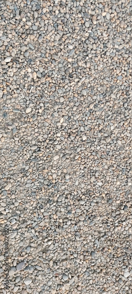 Small gray pebble beach. Backgrounds and textures. Small gray pebble beach. Backgrounds and textures.