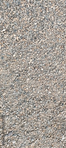 Small gray pebble beach. Backgrounds and textures.