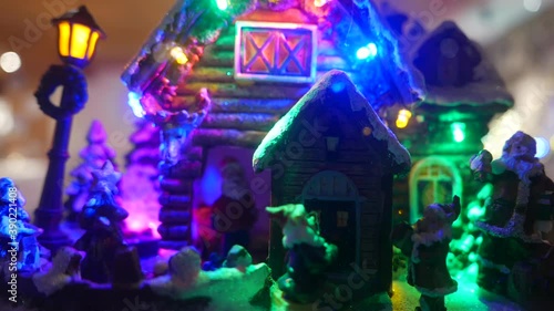 Miniature father Christmas house with lights
