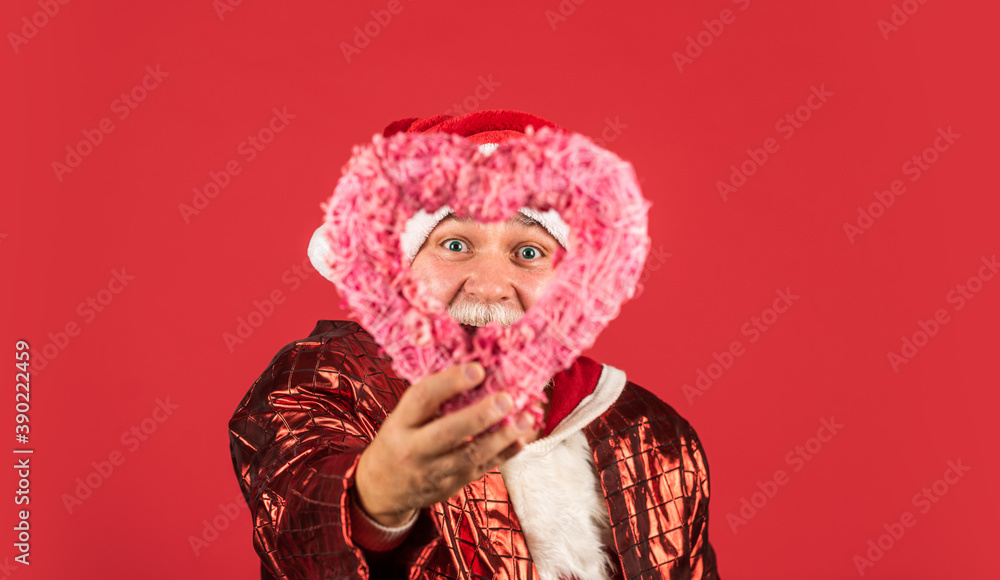 Fototapeta premium Lets do this. happy new 2021 year. merry christmas. bearded santa in hat hold decorative heart. xmas presents and gift shopping time. winter holiday joy. love. funny senior man in santa claus costume