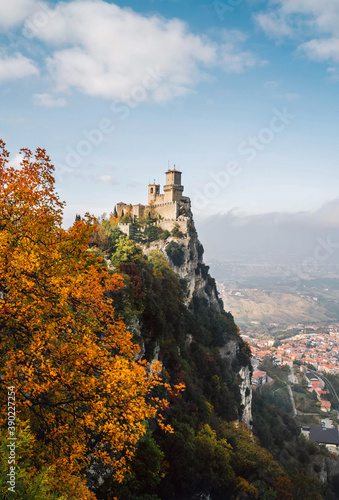 The tower of Fortress of Guaita on Monte Titano mountain - the highest in Republic of San Marino. Autumn landscape view overlooking the Valdragone city.