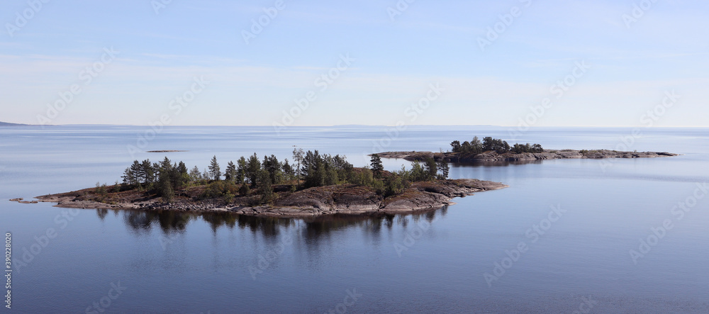 two small rocky islands on the lake two small rocky islands on the lake