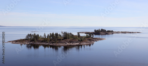 two small rocky islands on the lake © ElenKa