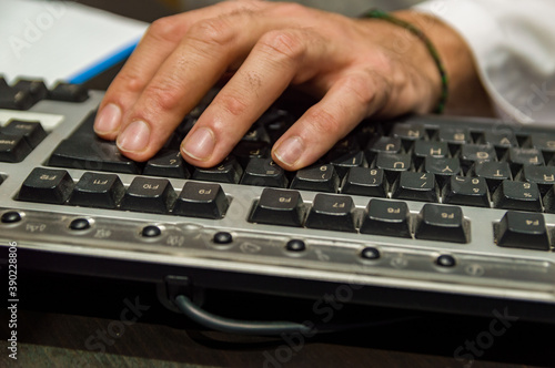 Man hands working on computer typing