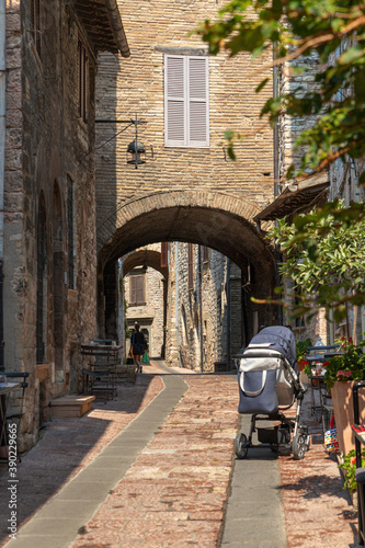Small characteristic street in the historic center of the famous city of Assisi  in Umbria  Italy 