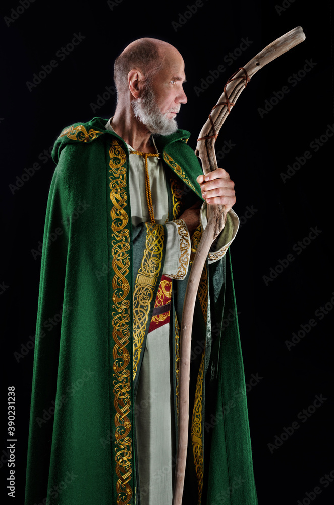 powerful wizard holds a wooden magic staff