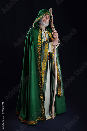 powerful wizard holds a wooden magic staff