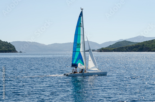 Evia island, Greece - June 28. 2020: Sailing boat on the move on the high seas 