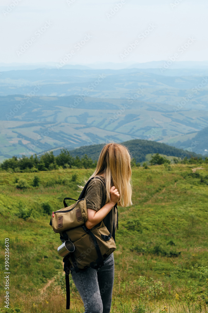 Beautiful nature landscape in mountains. Girl enjoy scenics view on valley. Hiking journey on tourist trail. Outdoor adventure. Travel and exploration. Healthy lifestyle, leisure activities