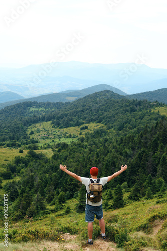 Beautiful nature landscape in mountains. Man enjoy scenics view on valley. Hiking journey on tourist trail. Outdoor adventure. Travel and exploration. Healthy lifestyle, leisure activities