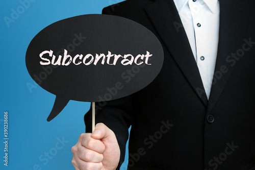 Subcontract. Businessman holds speech bubble in his hand. Handwritten Word/Text on sign. photo