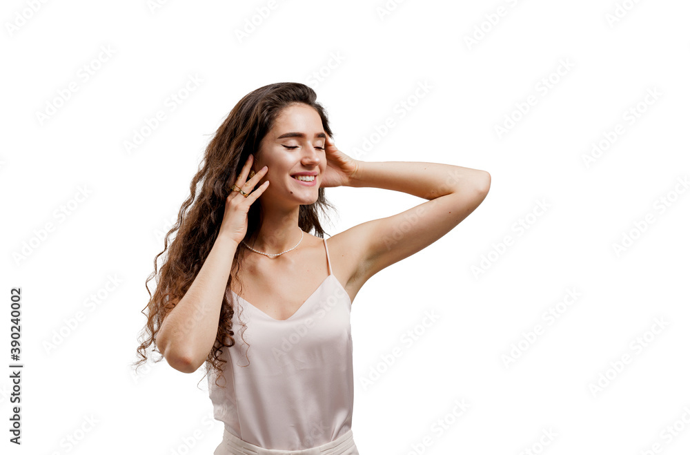 Attractive girl with clear skin and long wavy hair . Brunette with curly hairstyle. Young woman touches her face. Advert for spa, dermatologist, cosmetic salon. Attractive girl with clear skin and long wavy hair . Brunette with curly hairstyle. Young woman touches her face. Advert for spa, dermatologist, cosmetic salon.