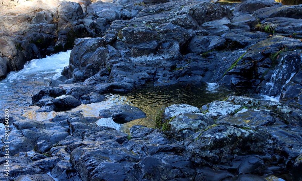 Rocks and small stream above the falls Rocks and small stream above the falls