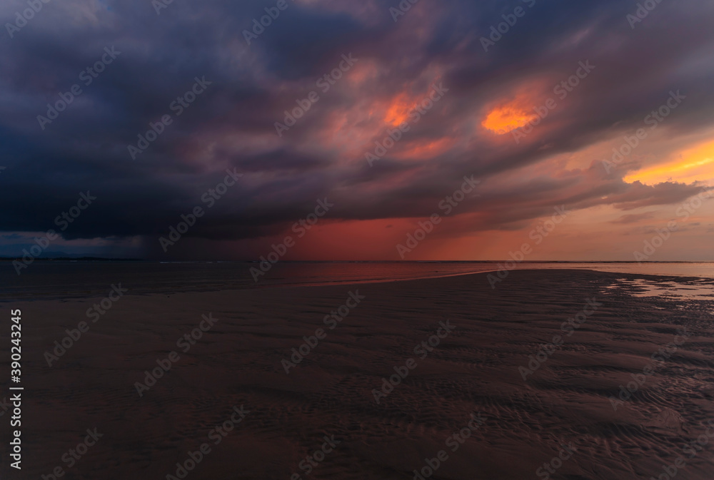 sea at tide under dramatic sunset sky sea at tide under dramatic sunset sky