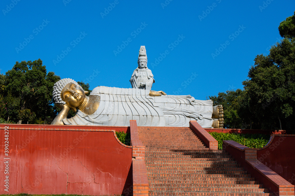 Obraz premium Buddha sculpture at Bacalhôa Buddha Eden, asian style garden, Quinta dos Loridos, Bombarral, Portugal, September 10, 2020