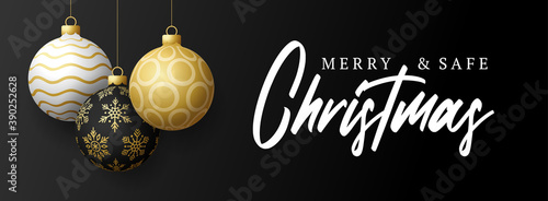 Merry and safe christmas banner. Vector illustration with three realistic Christmas tree ball golden, black and white color and lettering text. Holidays due coronavirus