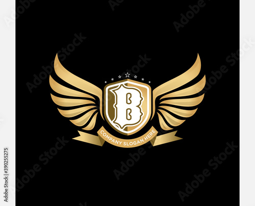 vector wing with shield and letter. logo template. logo emblem photo