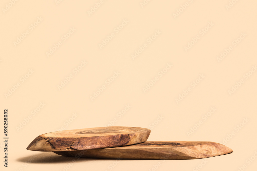 Rustic wood podium for cosmetics or perfume against beige background. Mockup. Rustic wood podium for cosmetics or perfume against beige background. Mockup.