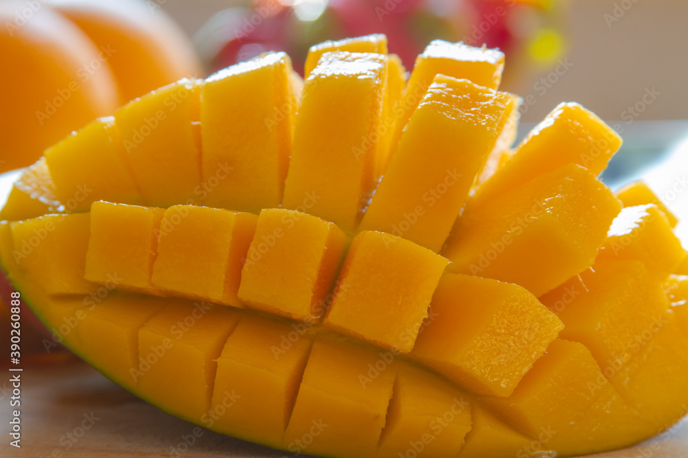 Haden mango cube cut green and red color mango close up. Haden mango cube cut green and red color mango close up.