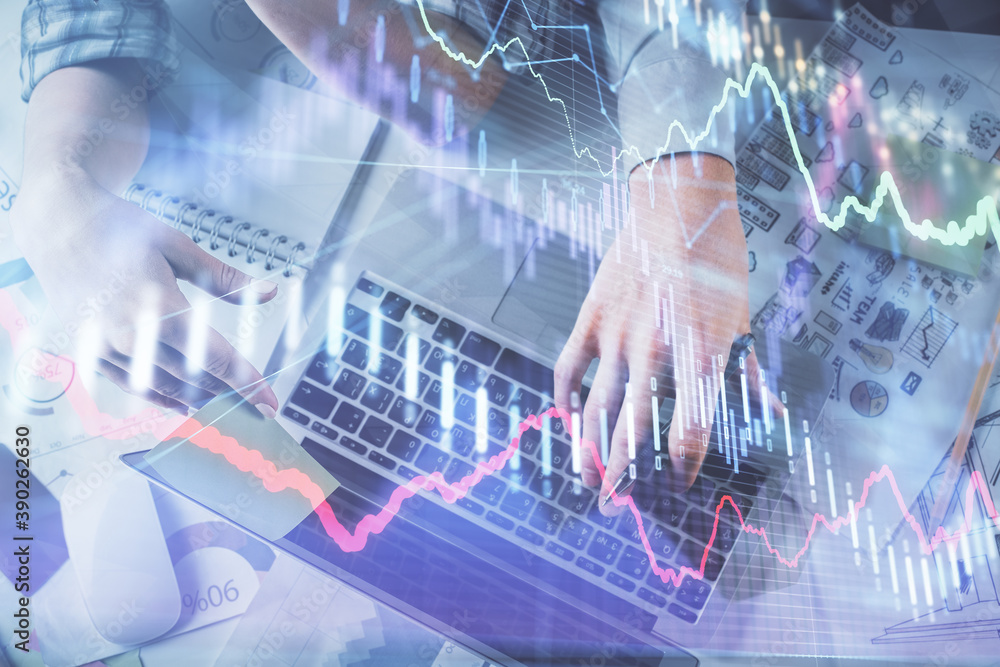 Double exposure of man and woman working together and forex graph hologram drawing. Financial analysis concept. Computer background. Top View. Double exposure of man and woman working together and forex graph hologram drawing. Financial analysis concept. Computer background. Top View.